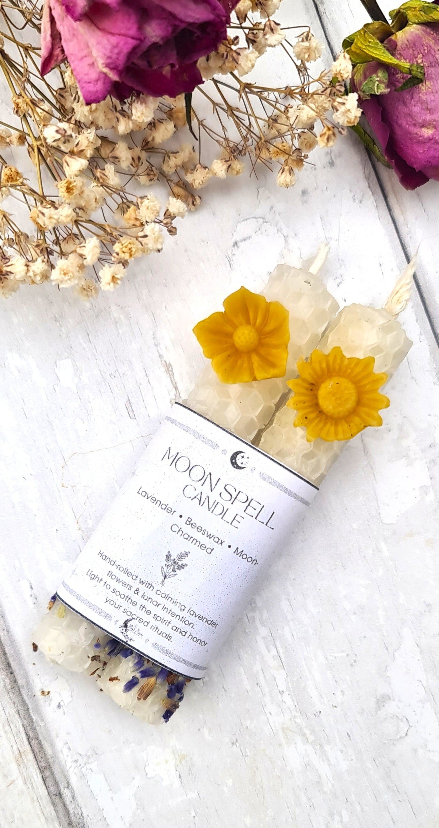 White beeswax candles with lavender flowers