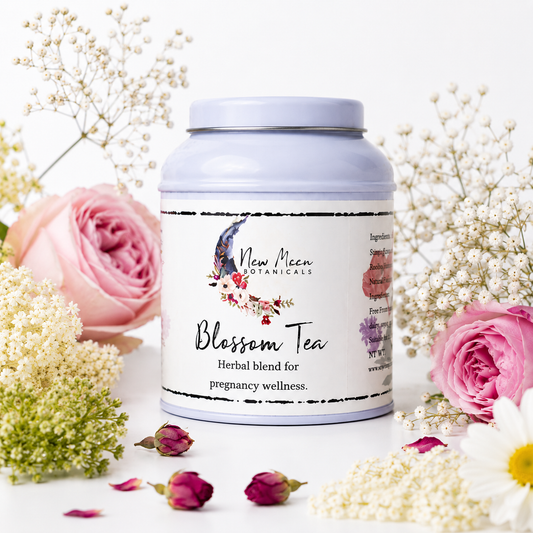 Bottle of New Moon Botanicals Blossom Tea with flowers on a white background
