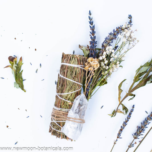 Handcrafted rosemary smudge stick with herbs 