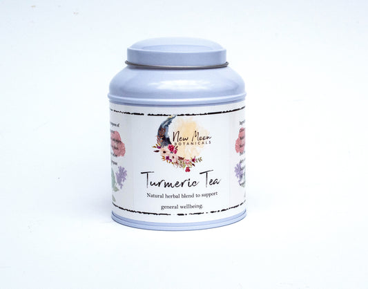 turmeric chai herbal tea in white tin
