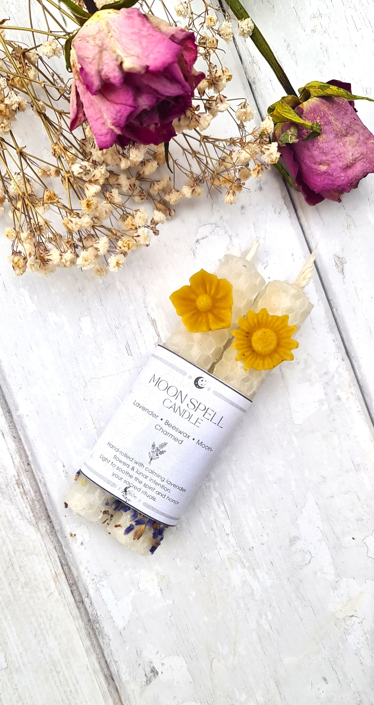 White beeswax candles with flowers 