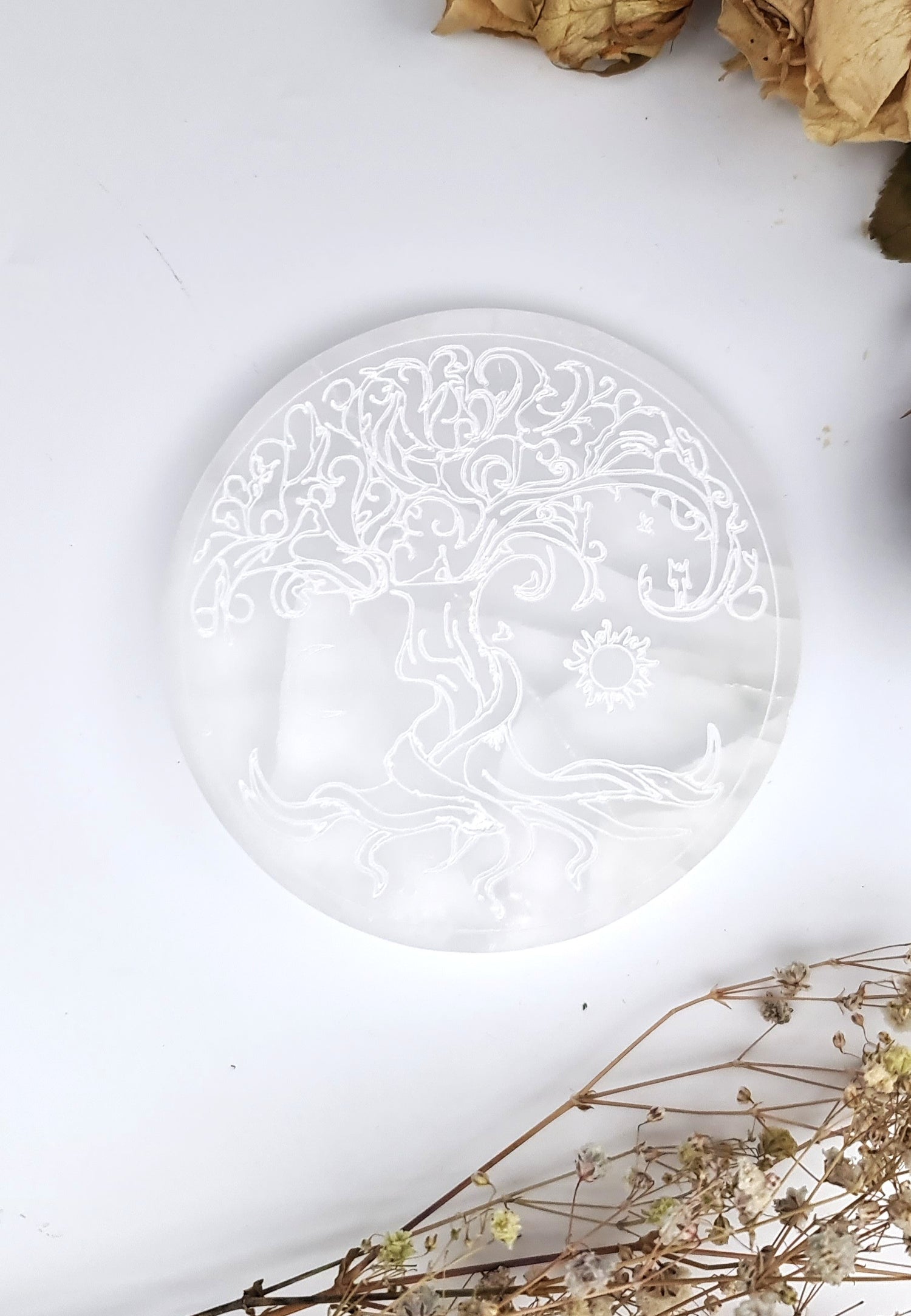 selenite charging plate on altar with candles